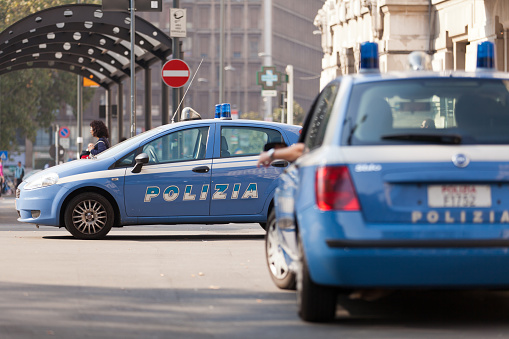 Italian Municipal Police with their patrols and cars direct traffic in the city, intervene in traffic accidents, and issue fines and penalties to motorists who do not obey traffic laws.