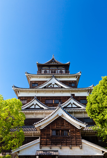 Hiroshima, Japan - June 16, 2010: View of Hiroshima castle. Originally constructed in the 1590s, the castle was destroyed in the atomic bomb in 1945. It was rebuilt in 1958.