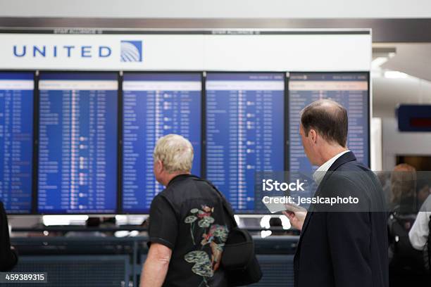 Departures Board Stock Photo - Download Image Now - United Airlines, Adult, Airplane