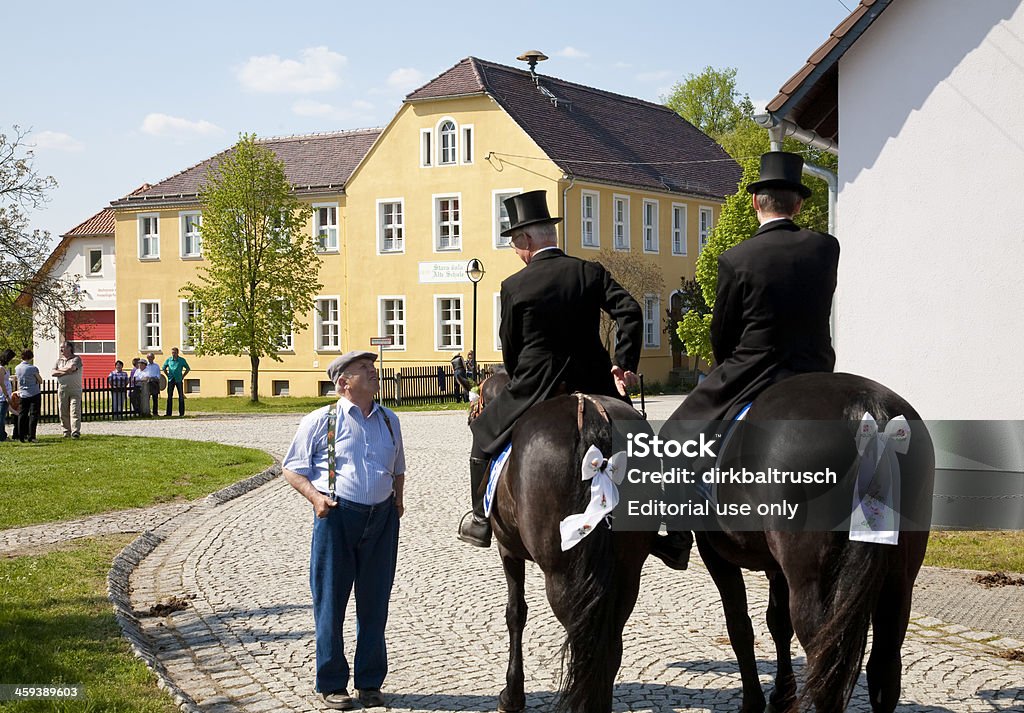 easter riding Ralbitz, Germany - April 24, 2011: easter riding of the german minority group of the Sorbians. Every Easter Sunday they carry on the message of resurrection of Jesus from place to place. At village square of Ralbitz Catholicism Stock Photo