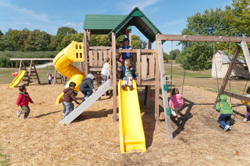 Mooresville,Indiana, United States - September 15, 2011:  Preschool children enjoy the playground at Anderson Orchards in Mooresville, Indiana.  Anderson Orchards is a favorite autumn field trip for preschool classes.