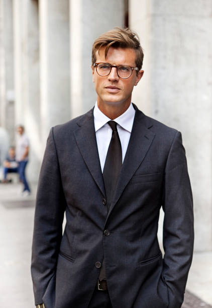 Streetstyle in Milan Fashion Week Milan, Italy -September 27th 2011: Elegant man walking in Corso Vittorio Emanuelle II. Last day of Fashion week in Milan lots of people well dressed were passing by wanting to be captured by a camera and probably like to be seen in fashion blogs. milan fashion week stock pictures, royalty-free photos & images