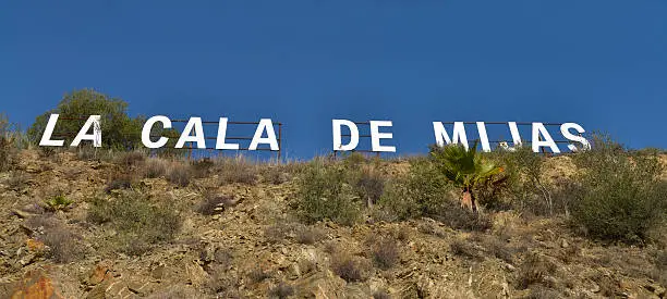 This sign sits on top of the hill that over looks the village of La cala de Mijas on the Costa del sol Spain. No filters were used on this file.