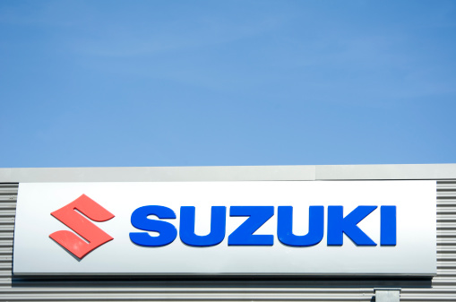 Bad Homburg vor der Hoehe, Germany - October 14, 2011:Suzuki sign  at the facade of a car dealers building. Suzuki is a Japanese manufacturer of automobiles, motorcycles, all-terrain vehicles and outboard marine engines. Suzuki is a multinational corporation headquartered in Hamamatsu, Japan. The company is the 4th biggest automobile manufacturer in Japan.