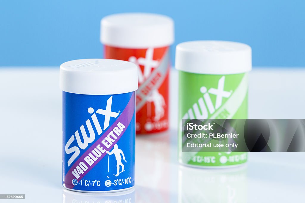 Sticks of Swix hard kick wax Montreal, Quebec, Canada - January 3, 2012: This is a studio shot of a basic kit of three sticks of cross-country skiing non-fluorinated Swix V Kick Wax including the green V20, the blue V40 and the red V60. Blue Stock Photo