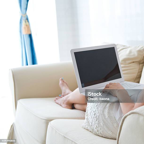 Using Laptop On Sofa Stock Photo - Download Image Now - Adult, Adult Student, Adults Only