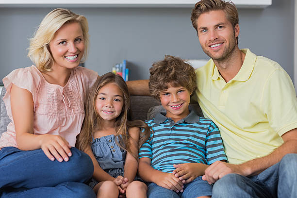 istock Happy family sitting on a sofa 459391307