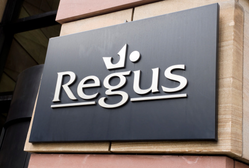 London, England - January 13, 2012: A sign outside a Regus business centre in Central London. Regus was founded in 1989 and has around 1,200 business centres worldwide. It was founded to enable people to work in an office environment instead of in hotel rooms, cafes, at home, or in their cars when they are away from their own places of work.