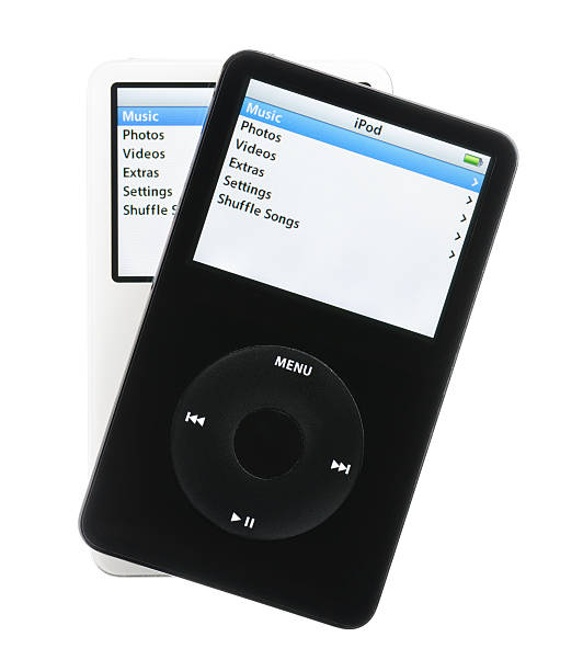 Apple iPods Colorado Springs, Colorado, USA - May 25, 2011: A pair of black and white iPods fanned out over a white background. Both iPods are displaying their home screens. The iPods in this photo are fifth generation Apple iPods. This model was the first iPod with video playback capabilities. mp3 player stock pictures, royalty-free photos & images