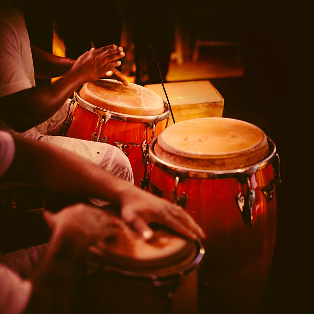 playing congas detail of hands playing latin percussion (tumbadora or congas) salsa music photos stock pictures, royalty-free photos & images