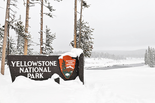Yellowstone National Park,Wyoming,USA - January 23, 2010: Sign marking the southern entrance of Yellowstone National Park in winter.
