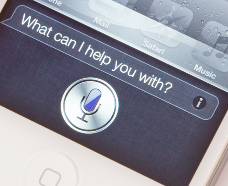 Los Angeles, USA - October 14, 2011: A white Apple iPhone 4S showing the new Siri voice application. Siri is a voice recognition system which allows users to control the phone by using spoken words.