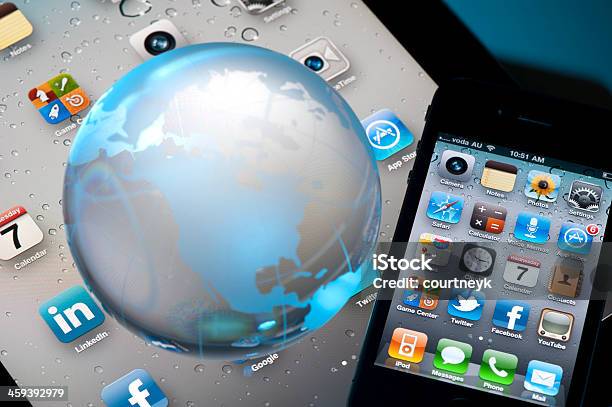 Iphone 4 And Ipad2 With A World Globe Stock Photo - Download Image Now - Globe - Navigational Equipment, Apple Computers, Big Tech