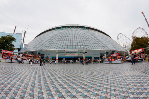 Tokyo, Japan - September 30, 2011 : People outside the main entrance of Tokyo Dome. Tokyo Dome is located in Koraku 1-chome, Bunkyo, Tokyo, Japan. It is an all-weather multipurpose stadium in Japan.
