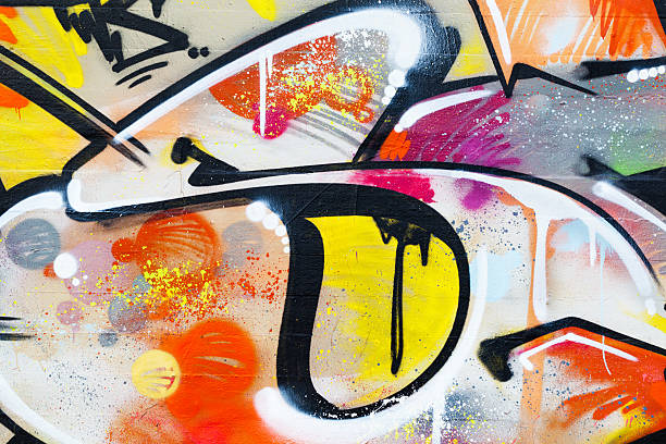 graffiti-detail - orange wall textured paint stock-fotos und bilder