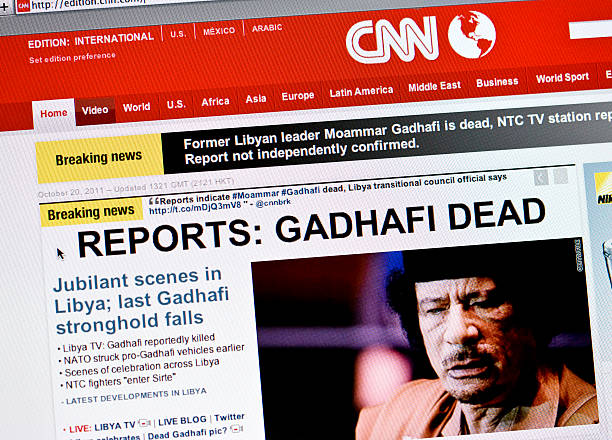 Gadhafi dead Wiesbaden, Germany - October 20, 2011: Close up of the www.cnn.com web pages show breaking news about the death of Muammar Gaddafi or Gadhafi, the former  autocratic ruler of Libya. Cable News Network (CNN) is a U.S.news channel headquartered in Atlanta, Georgia and founded in 1980 by Ted Turner. The browser is Safari 5 libyan culture stock pictures, royalty-free photos & images