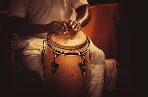 playing congas detail of hands playing latin percussion (tumbadora or congas) rumba photos stock pictures, royalty-free photos & images