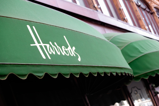 London, United Kingdom - September 18, 2011: advertising canopy over the entrance to Harrods Department Store in Knightsbridge London.