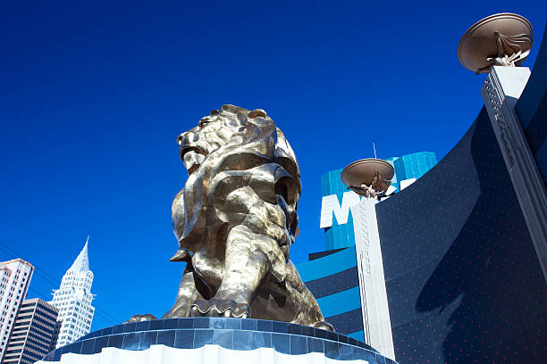 Las Vegas, Nevada, United States - December 30, 2008: A golden statue of the MGM lion surveys the skyline of Las Vegas, Nevada in front of the  MGM Grand Hotel.