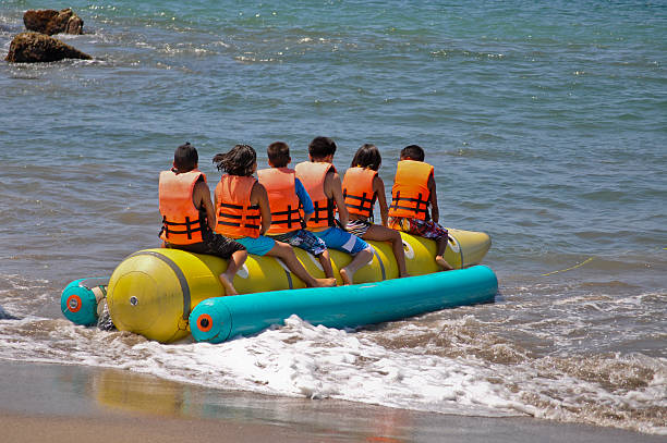 Children on Tow Toy at Puerto Vallarta Mexico Beach Resort stock photo