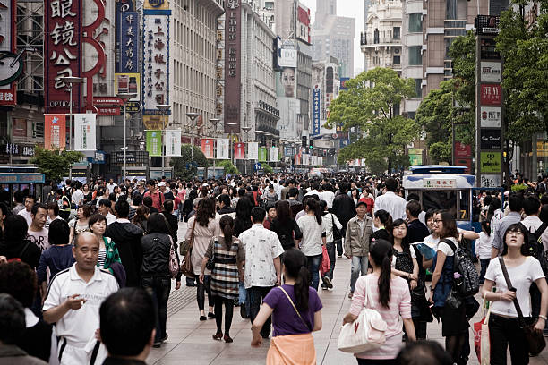 Shanghai, China - May, 15 2010:  crowd of Chinese tourists in Nanjing Street, Shanghai, China.