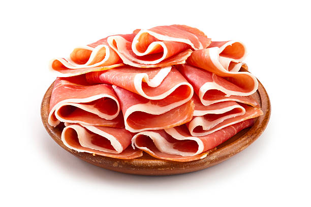 ham Prosciutto Slices on White Background parma ham stock pictures, royalty-free photos & images