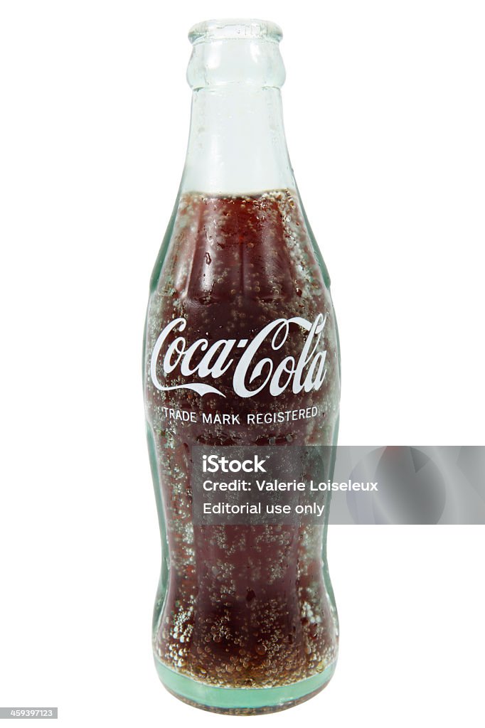 Coca-Cola bottle Cantley, Quebec, Canada - October 3, 2011: A product shot of a Fresh Coca-Cola Bottle on white background. Coca-Cola is a product of Coca-Cola Company.  Drinking Glass Stock Photo