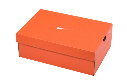 Breuberg, Germany - January 10, 2012: Studio shot of a Nike shoe packaging isolated on white.. Nike are a massive American sportwear equipment manufacturer. They are  headquartered in Oregon, USA. Nike was founded in January 1964 and produces several type of shoes from casual to olympic competition equipment.