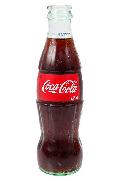 Izmir, Turkey - 16 April 2011: 250ml glass Coca-Cola bottle on ice stack