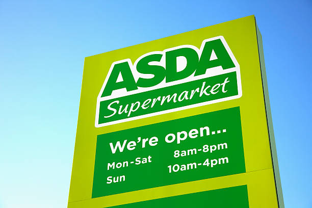 ASDA Supermarket sign and logo Malton, UK - December 22, 2011: ASDA Supermarket sign and logo. Asda Stores Ltd. is a British supermarket chain which retails food, clothing, general merchandise, toys and financial services. Asda became a subsidiary of the American retail giant Walmart in 1999. asda photos stock pictures, royalty-free photos & images