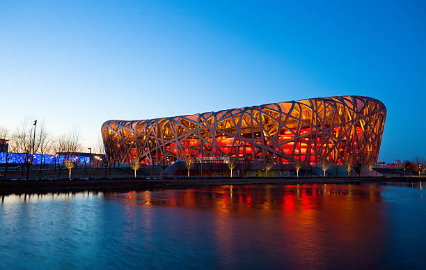 Beijing National Stadium by night - The Bird's Nest Beijing, China - March 6, 2011: Located on Beijing Olympic Green, the Beijing National Stadium or the Bird's Nest was home of the 2008 Beijing Olympics. beijing olympic stadium photos stock pictures, royalty-free photos & images