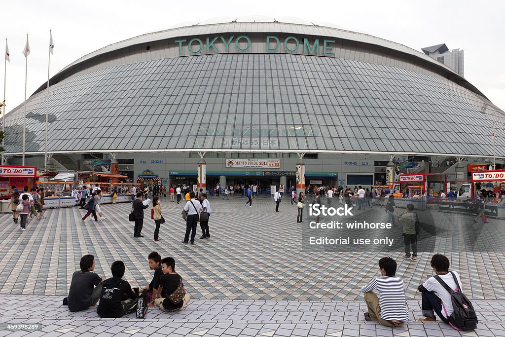 Tokyo Dome in Japan Tokyo, Japan - September 30, 2011 : People outside the main entrance of Tokyo Dome. Tokyo Dome is located in Koraku 1-chome, Bunkyo, Tokyo, Japan. It is an all-weather multipurpose stadium in Japan. Tokyo Dome Stock Photo