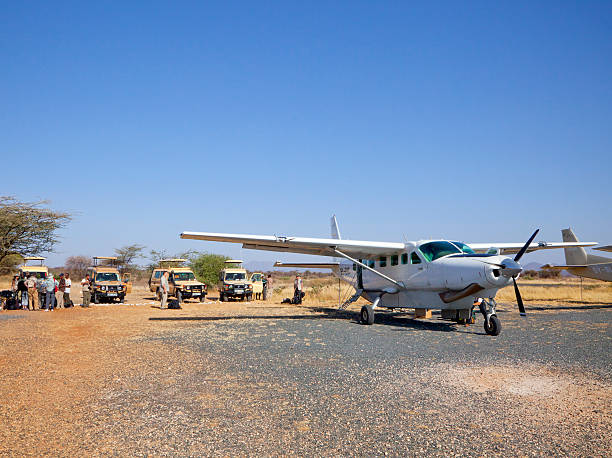 Samburu African safari with land vehicles and aircraft stock photo