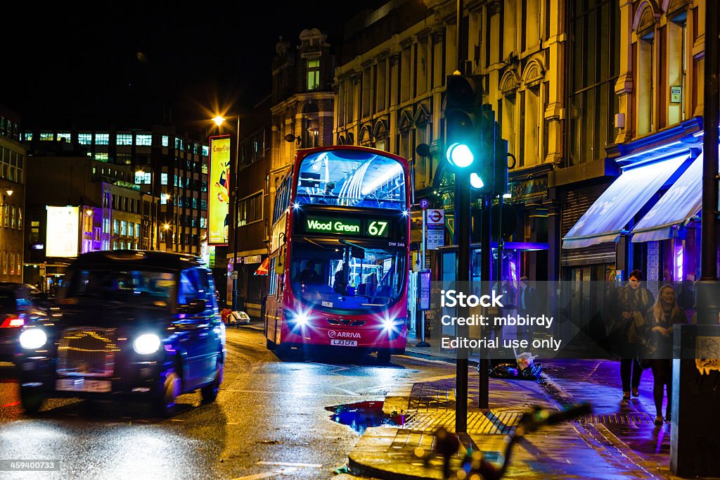 Shoreditch High Street, London at night London, United Kingdom - October 28, 2013: City life on London's Shoreditch High Street at night. People commuting home or going out in bars and restaurants. Architecture Stock Photo