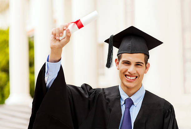 istock Excited Boy Holding Diploma On Graduation Day At Campus 459400887