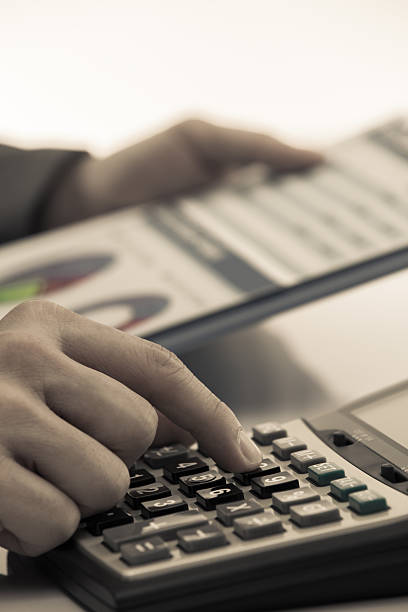 istock man hand with business report 459402461