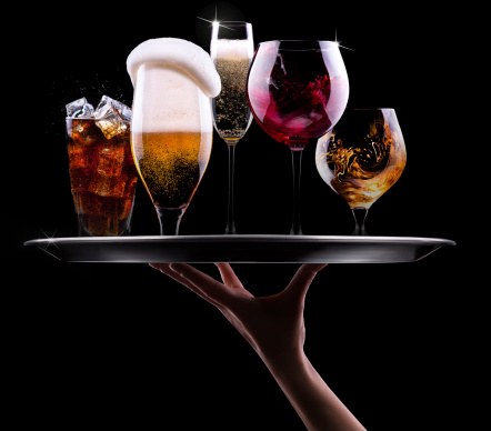 tray with different drinks on black background - champagne, beer, cocktail, wine, brandy, whiskey, scotch, vodka, cognac