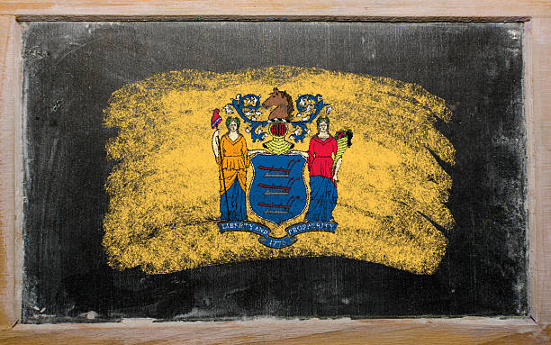 flag of US state new jersey on blackboard painted Chalky american state of new jersey flag painted with color chalk on old blackboard jerseyan stock pictures, royalty-free photos & images