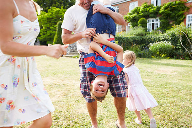 istock Family Having Fun Playing In Garden 459409513