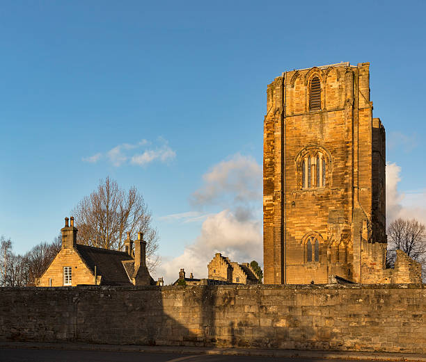 This is the view of part of Elgin Cathedral with the Bishops House in the background. This is with sun suing on a December afternoon in Moray, Scotland, United Kingdom.
