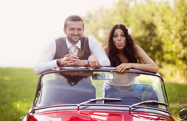 istock Wedding car with bride and groom 459419227