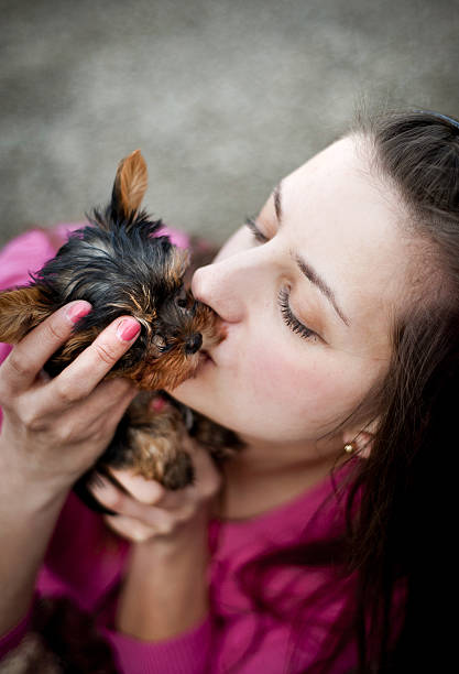 istock Woman and puppy 459420009