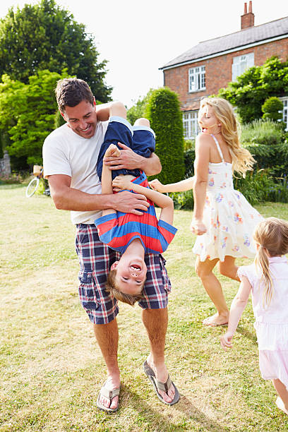 istock Family Having Fun Playing In Garden 459427015