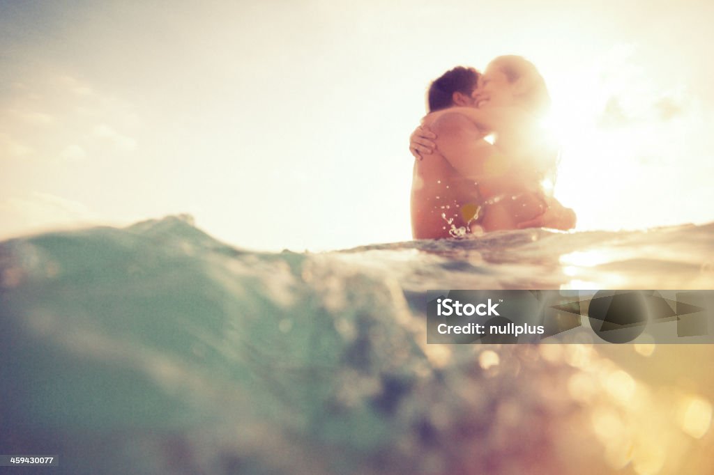 young couple having fun in the sea Couple - Relationship Stock Photo