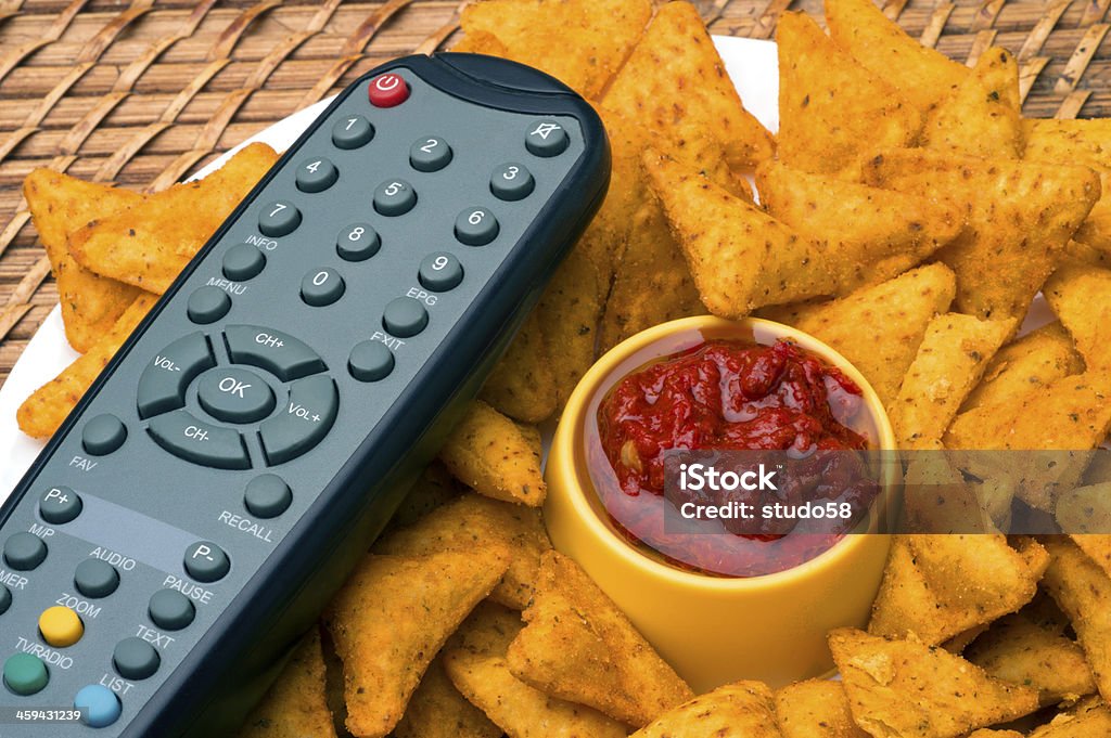 potato chips potato chips and remote control Appetizer Stock Photo