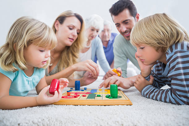 istock Family playing with a board game 459432205