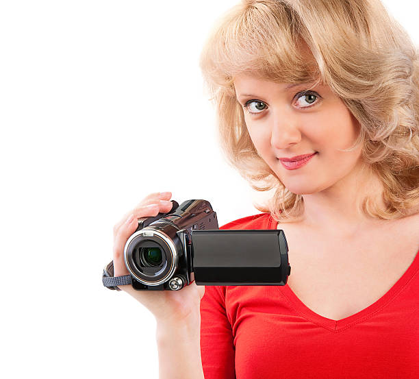 istock Woman holding a home video camera 459434027