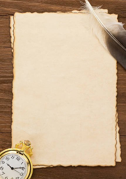 istock ink feather and watch on parchment background 459434037