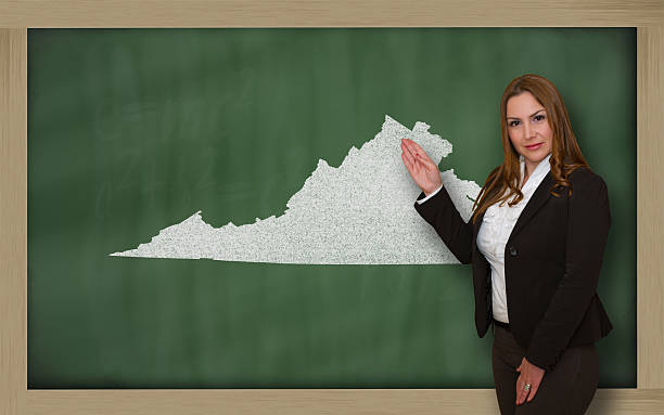istock Teacher showing map of virginia on blackboard 459434449
