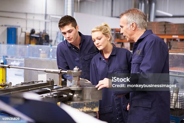 Engineer Teaching About Tube Bending Machine Stock Photo - Download Image Now - Trainee, Occupation, Machinery